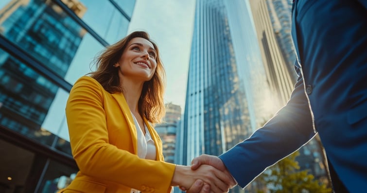 Australian woman and a businessman shaking hands