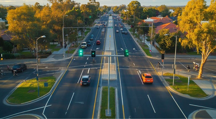 Aerial photograph of Intersection, Morning in East Melbourne, the roads have bike lanes and sidewalk, clear traffic lights with smart sensor