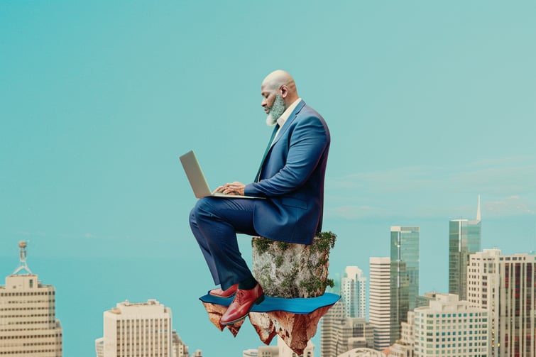 man wearing blue business clothes with his laptop