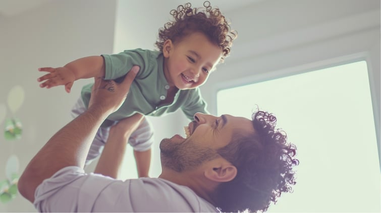 Dad playing with his son in their new house