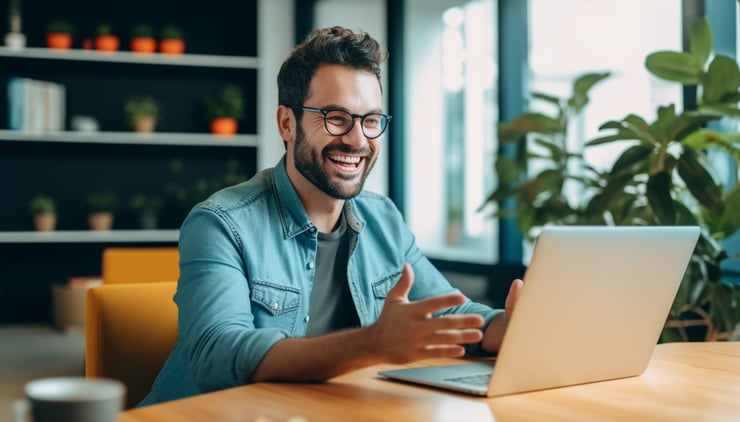 Casual photograph of a man talking during a video meeting