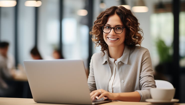 Front view candid shot of a confident professonal woman in her late 30s busy working